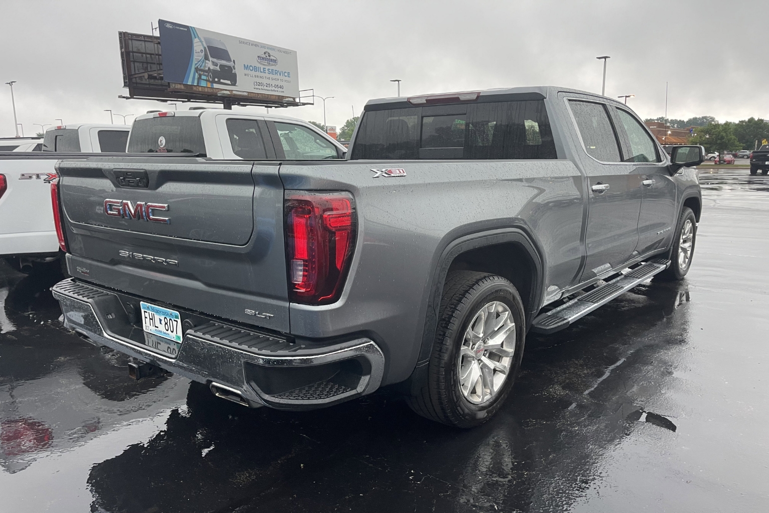 Used 2021 GMC Sierra 1500 SLT with VIN 3GTU9DED6MG143174 for sale in St. Cloud, Minnesota